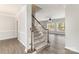 Inviting home entryway with hardwood floors, carpeted stairs, and a view to the living room at 11526 Mcginns Trace Ct, Charlotte, NC 28277