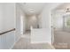 The upstairs hallway features carpet and white walls at 11526 Mcginns Trace Ct, Charlotte, NC 28277