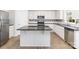 Bright kitchen with granite counters, stainless appliances, central island, and wood flooring at 11526 Mcginns Trace Ct, Charlotte, NC 28277