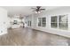 Spacious living room with open floor plan, leading into kitchen with stainless steel appliances at 11526 Mcginns Trace Ct, Charlotte, NC 28277