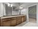 Bathroom featuring a double vanity, and view to the loft at 120F Steinbeck Way, Mooresville, NC 28117