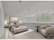 Stylishly furnished bedroom featuring an arched window, and soft color palette at 120F Steinbeck Way, Mooresville, NC 28117