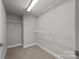 Neutral closet featuring wire shelving, and carpet flooring at 120F Steinbeck Way, Mooresville, NC 28117