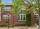 Brick building with a view of double doors and manicured shrubbery at 120F Steinbeck Way, Mooresville, NC 28117
