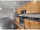 Beautiful kitchen featuring granite countertops, wood floors, and stainless steel appliances at 120F Steinbeck Way, Mooresville, NC 28117