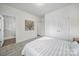 Spacious bedroom featuring soft carpet, ensuite bathroom, and ample closet space at 13222 Fiore Pl, Huntersville, NC 28078