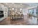 Well-designed kitchen with an open floor plan, featuring an island with seating, and a dining area at 13222 Fiore Pl, Huntersville, NC 28078