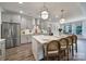 Spacious kitchen with a large island, stainless steel appliances, pendant lights, and an open layout at 13222 Fiore Pl, Huntersville, NC 28078