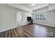 Versatile office space with a window, modern desk, and views of the carpeted room next door at 13222 Fiore Pl, Huntersville, NC 28078