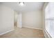Empty bedroom features neutral carpet, a window and a closet at 13358 Calloway Glen Dr, Charlotte, NC 28273