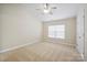 Spacious bedroom with carpet flooring, ceiling fan and window at 13358 Calloway Glen Dr, Charlotte, NC 28273