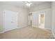 Bright bedroom with carpet, closet, and ensuite bathroom access at 13358 Calloway Glen Dr, Charlotte, NC 28273