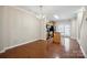 Cozy dining room with chandelier, hardwood floors, and direct access to the kitchen at 13358 Calloway Glen Dr, Charlotte, NC 28273