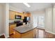 Well-equipped kitchen with modern appliances, a center island, and convenient access to the outdoors at 13358 Calloway Glen Dr, Charlotte, NC 28273