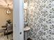 Charming powder room featuring floral wallpaper, a pedestal sink, and stylish lighting at 134 Kerri Dawn Ln # 117, Locust, NC 28097