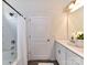 Neutral bathroom with a white vanity, framed mirror, and shower-tub combination with shower curtain at 134 Kerri Dawn Ln # 117, Locust, NC 28097