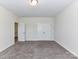 Carpeted bedroom with double door closet and neutral walls, offering a serene and clutter-free environment at 134 Kerri Dawn Ln # 117, Locust, NC 28097