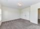 Carpeted bedroom with double closet and neutral walls, offering a serene and spacious feel at 134 Kerri Dawn Ln # 117, Locust, NC 28097