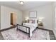 Bedroom features a metal bed frame and a patterned rug at 134 Kerri Dawn Ln # 117, Locust, NC 28097