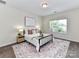 Comfortable bedroom featuring a large window and stylish decor at 134 Kerri Dawn Ln # 117, Locust, NC 28097
