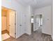 Upstairs hallway with carpet flooring gives access to bathroom and bedrooms at 134 Kerri Dawn Ln # 117, Locust, NC 28097