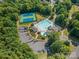 Community amenities include a swimming pool, tennis courts, playground, parking and lush green spaces at 1402 Coachman Dr, Waxhaw, NC 28173