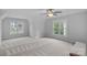 Spacious bonus room with ample natural light from large windows and neutral carpet at 1402 Coachman Dr, Waxhaw, NC 28173
