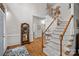 Elegant entryway featuring hardwood floors, a staircase with carpet, and decorative mirror at 1402 Coachman Dr, Waxhaw, NC 28173