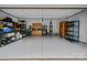 Organized garage with epoxy flooring, storage cabinets, and shelving units at 1402 Coachman Dr, Waxhaw, NC 28173