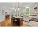Spacious kitchen with island, stainless steel appliances and views of the breakfast nook at 1402 Coachman Dr, Waxhaw, NC 28173