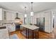 Beautiful kitchen featuring a center island, stainless steel appliances and custom cabinets at 1402 Coachman Dr, Waxhaw, NC 28173