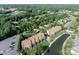 Community aerial view showcasing lush landscaping and a pristine lake at 18631 Harborside Dr, Cornelius, NC 28031