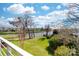 Backyard view of waterfront homes with lush green grass at 18631 Harborside Dr, Cornelius, NC 28031