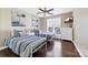 Charming bedroom with two twin beds, hardwood floors, a ceiling fan, and stylish decor at 18631 Harborside Dr, Cornelius, NC 28031