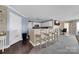 Open-concept kitchen with bar seating, white cabinets, and views into the adjacent living spaces at 18631 Harborside Dr, Cornelius, NC 28031