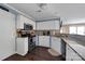 Functional kitchen with white cabinets, modern appliances, and granite countertops at 18631 Harborside Dr, Cornelius, NC 28031
