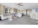 Bright living room with neutral tones, plush seating, and natural light at 18631 Harborside Dr, Cornelius, NC 28031
