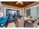 Inviting covered patio features comfortable seating and water views at 18631 Harborside Dr, Cornelius, NC 28031