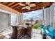 Inviting covered patio features comfortable seating and beautiful water view at 18631 Harborside Dr, Cornelius, NC 28031