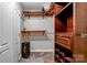 Organized walk-in closet with custom wood shelving, drawers, and ample storage space at 18631 Harborside Dr, Cornelius, NC 28031
