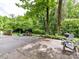 Backyard patio featuring seating area, grill, and outdoor furniture for entertaining at 2401 Wensley Dr, Charlotte, NC 28210