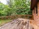 Wooden deck overlooking lush backyard offering a serene outdoor space with wood railings at 2401 Wensley Dr, Charlotte, NC 28210