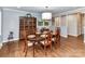 Traditional dining room with hardwood floors, a large wood table and an antique china cabinet at 2401 Wensley Dr, Charlotte, NC 28210