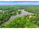 Aerial view of lake surrounded by lush greenery and residential areas at 2606 Walker Rd, Matthews, NC 28105
