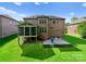 Beautiful brick home featuring a screened porch and brick patio with well maintained lawn at 2606 Walker Rd, Matthews, NC 28105