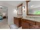 Elegant bathroom with dual vanities and granite countertops offering a stylish and functional space for personal care at 2606 Walker Rd, Matthews, NC 28105