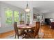 Cozy breakfast nook with bright windows offers a charming space for dining with natural light and inviting ambiance at 2606 Walker Rd, Matthews, NC 28105