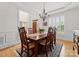 Elegant dining room with hardwood floors, chandelier, and views of the front entryway at 2606 Walker Rd, Matthews, NC 28105