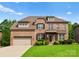 Traditional brick home with manicured lawn, attached garage, and inviting front entrance at 2606 Walker Rd, Matthews, NC 28105