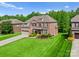 Beautiful red brick home with manicured front lawn and lovely landscaping at 2606 Walker Rd, Matthews, NC 28105